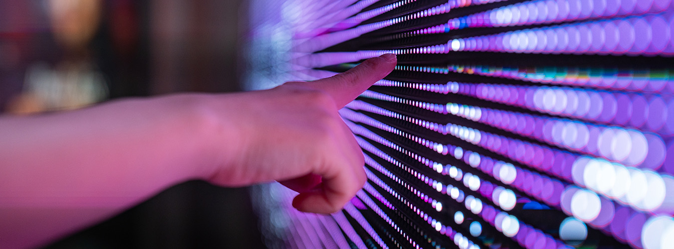 Hand touching a digital screen